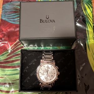 Bulova women’s watch. Chrome color Diamonds.  Round face.  TREAT YOUR SELF🎶😊